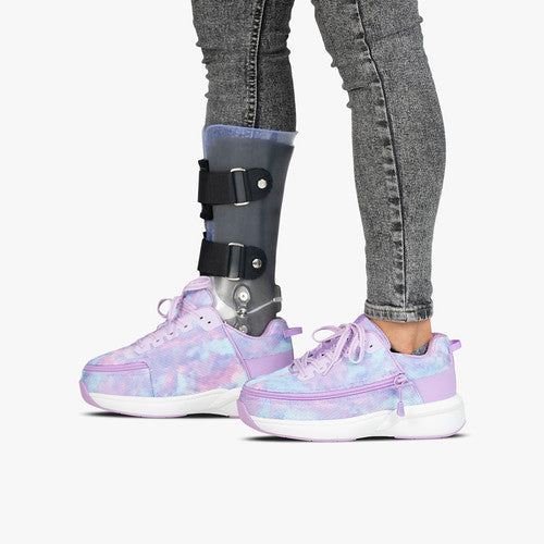 Toddler - Lilac Watercolour Limitless Low Top Shoes, shown with one shoe over a medical walking boot, highlighting adaptability and ease from Billy Footwear.