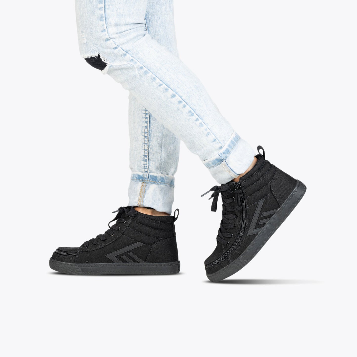 Black to the Floor BILLY CS High Tops featuring functional laces and wraparound zipper, designed for style and convenience, worn with jeans.