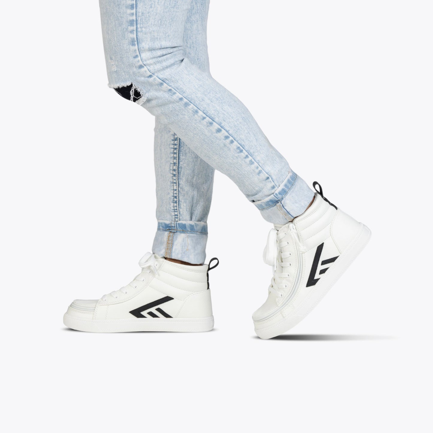 Toddlers - White/Black BILLY CS High sneakers, featuring wraparound zipper and functional laces, worn with ripped jeans, highlighting convenience and style.