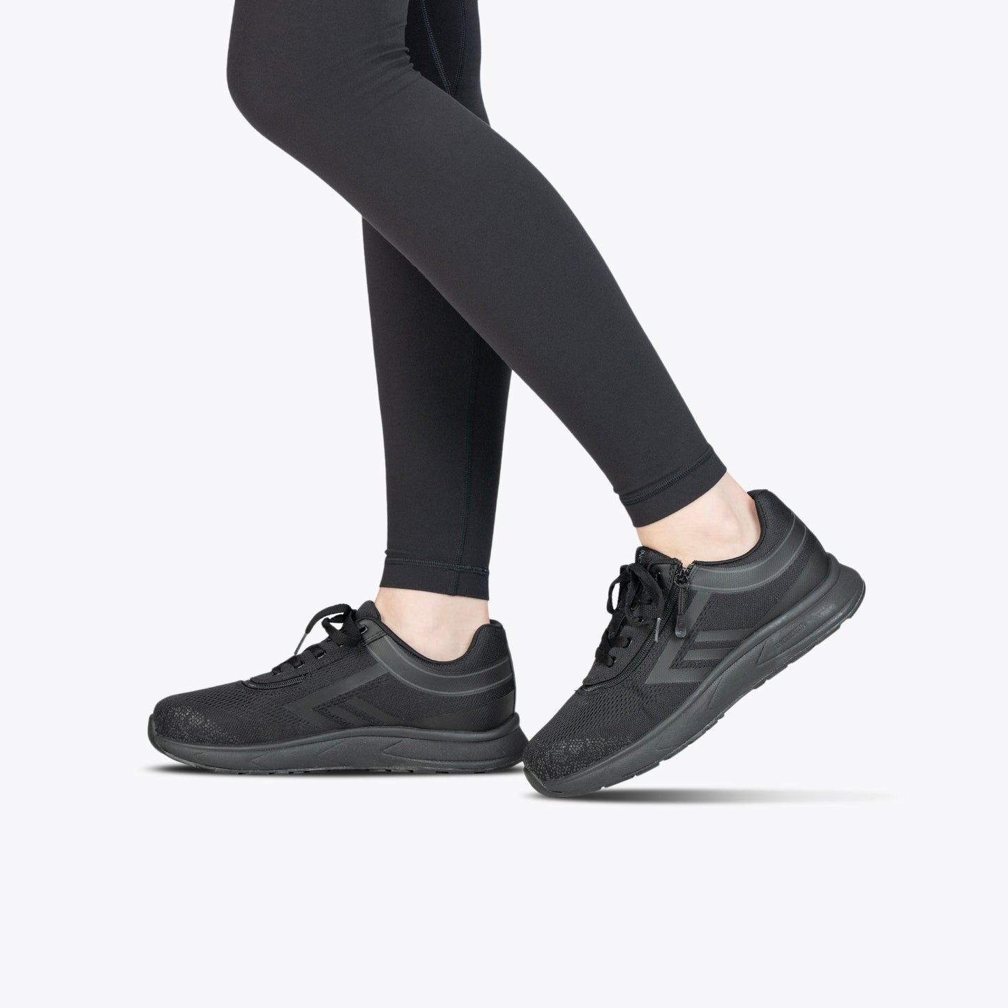Black to the Floor BILLY Sport Inclusion sneakers with padded collar and short-wrap zipper for easy access, shown on a person's feet.