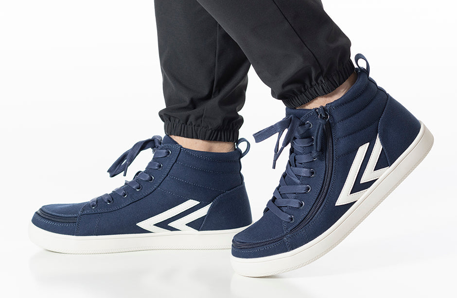 Men's Navy/White BILLY CS Sneaker High Tops, featuring wraparound zipper and functional laces, worn by a person, showcasing their stylish and accessible design.