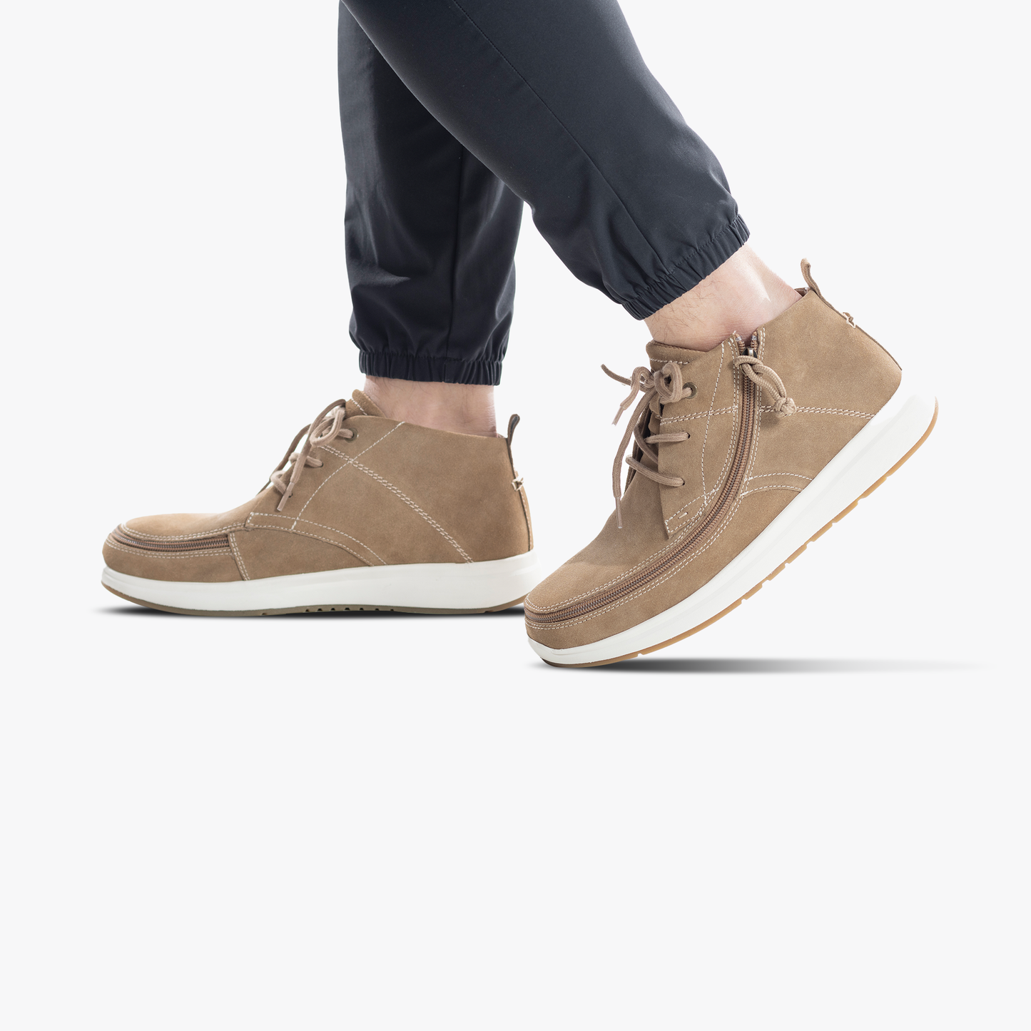 Men's Sand Suede BILLY Comfort Chukka with wraparound zipper, shown on feet, highlighting easy access design and stylish appearance.