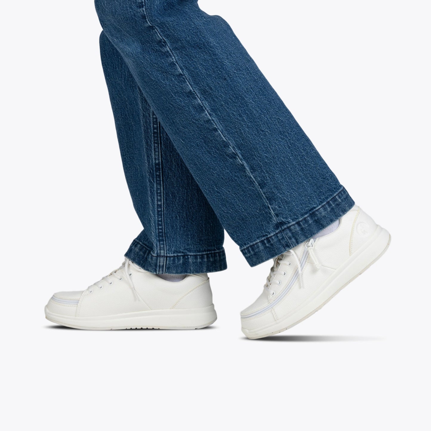Women's White BILLY Work Comfort Low shoes with wraparound zipper, shown worn with jeans, offering slip-resistant function and easy wear for work environments.