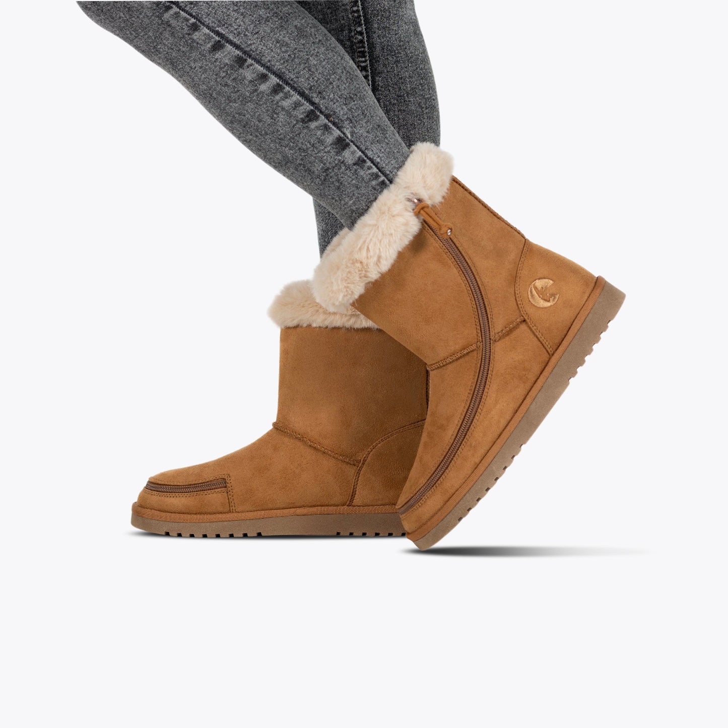 Women's Chestnut BILLY Cozy Boot with fur lining and zipper, worn by a person. Ideal for chilly weather, providing comfort and ease of use.