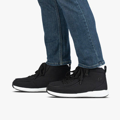 Men's Black Billy Goat Classic High shoes, featuring jeans-clad legs. Designed for AFO convenience with a short-wrap zipper for easy wear.