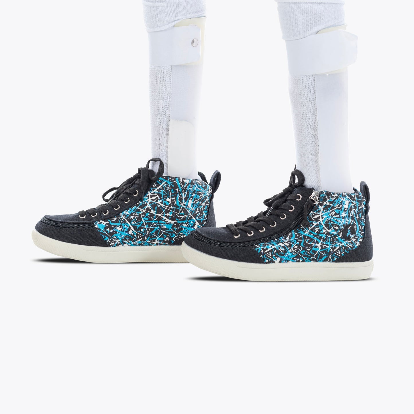 Black Graffiti BILLY Classic D|R II High Top shoes with white socks, featuring full-wrap zipper closure and adjustable laces for easy accessibility.